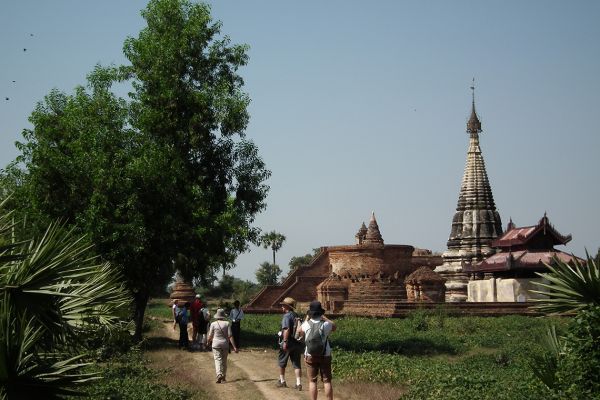 Walking to visit a Buddhist temple, Myanmar